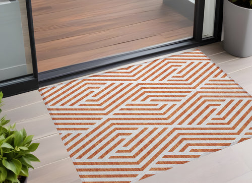 2 X 3 Orange and White Geometric Washable Non Skid Indoor Outdoor Area Rug