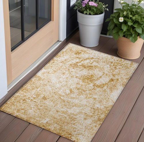 2 X 3 Cream and Gold Abstract Washable Non Skid Indoor Outdoor Area Rug