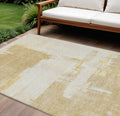 9 X 12 Beige Gold And Tan Abstract Washable Indoor Outdoor Area Rug