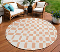 8 Peach And Beige Round Geometric Washable Indoor Outdoor Area Rug