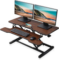 FITUEYES Height Adjustable Standing Desk 36    Wide Sit to Stand Converter Stand Up Desk Tabletop Workstation for Laptops Dual M