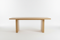 Modern oak dining table with natural wood grain and minimalist design